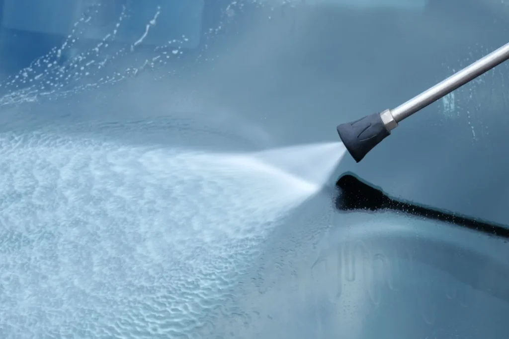 Cleaning windows with a pressure washer