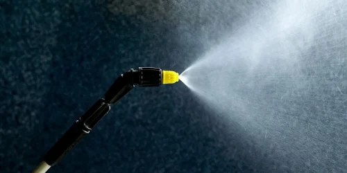 Cleaning windows with a pressure washer